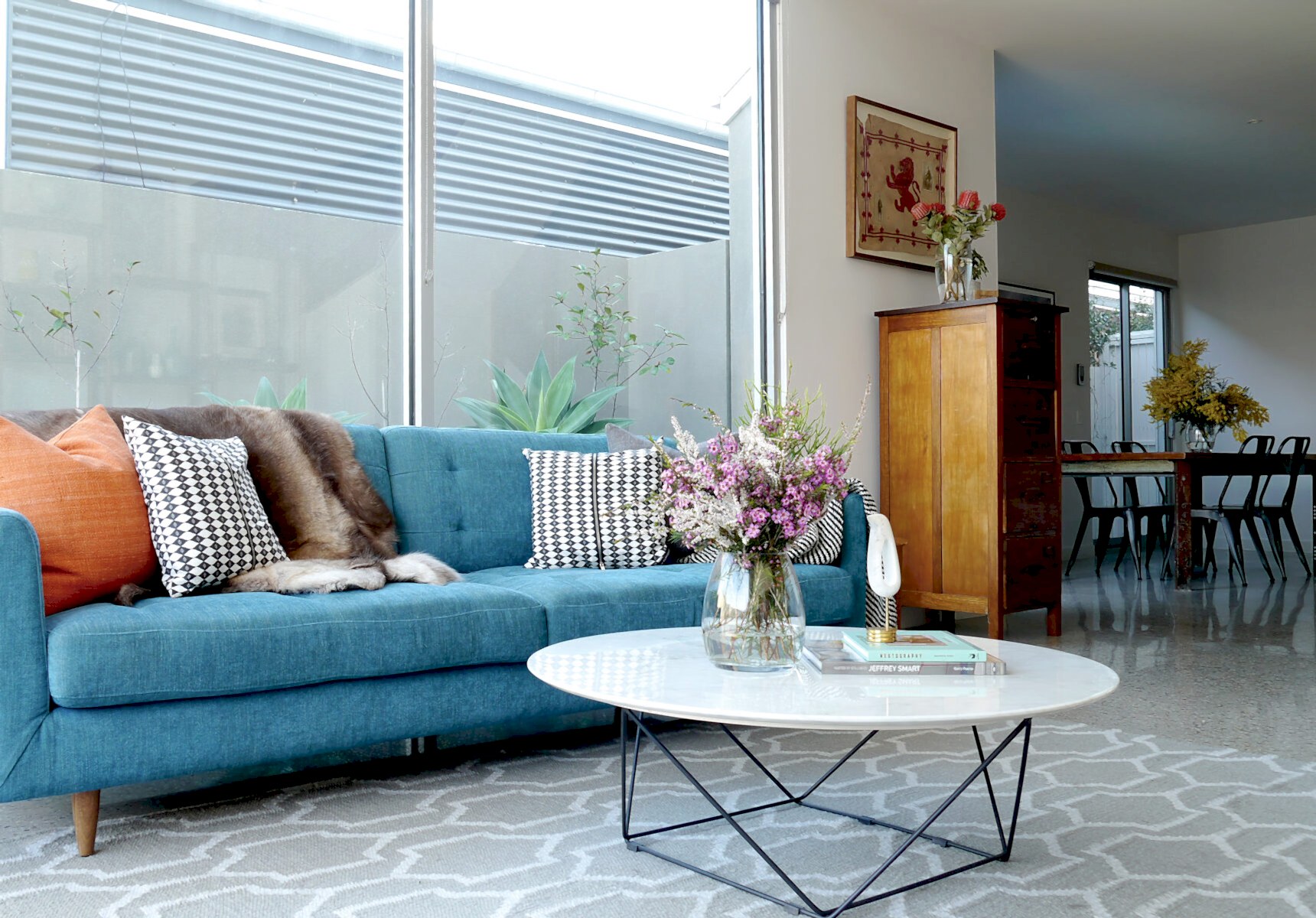 Melbourne-made modernist blue sofa with burnt orange accents