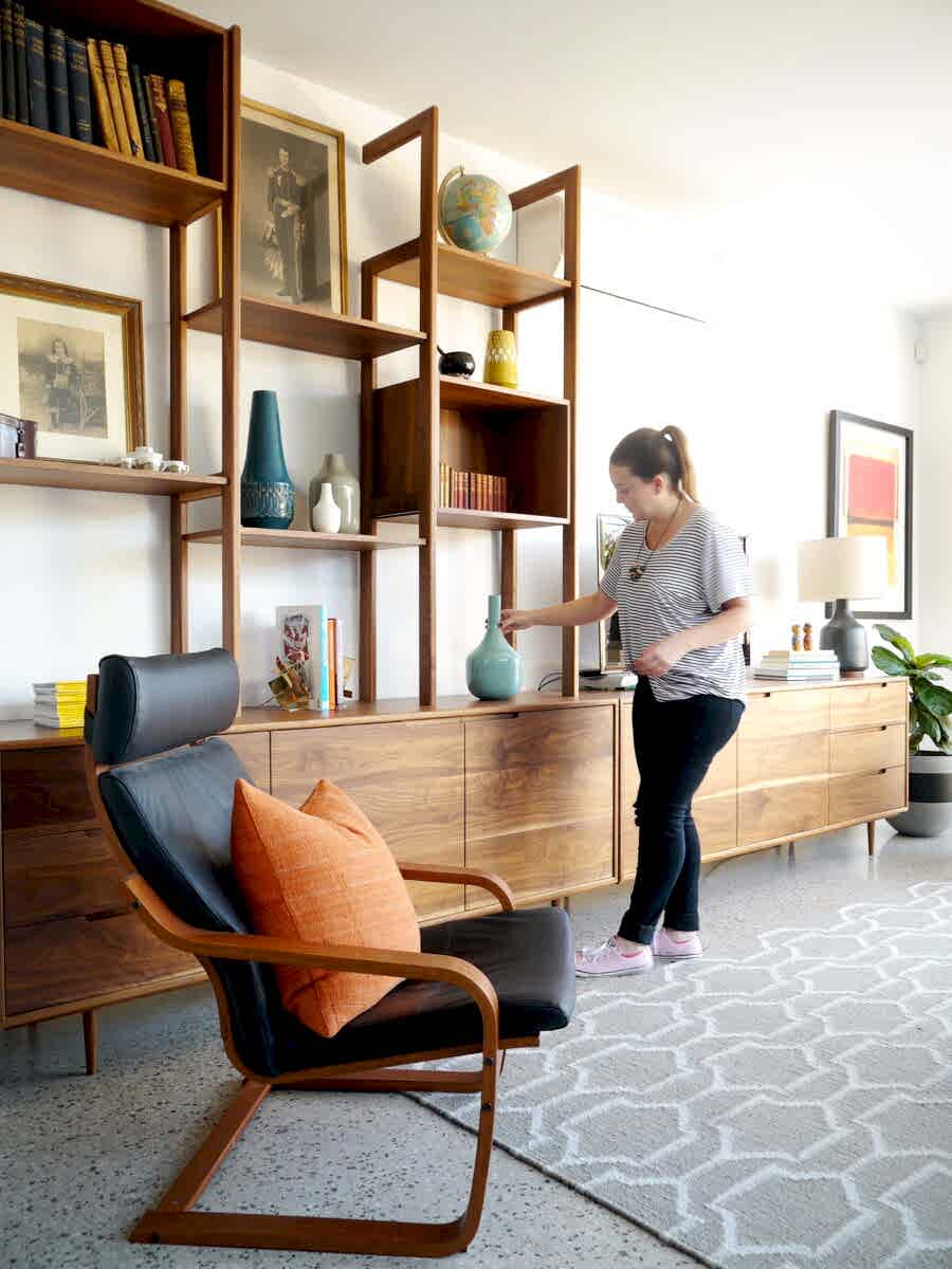 Polished concrete floors with midcentury style furniture Interior design detail showing layered, timeless styling
